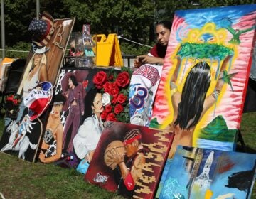 an artist selling multiple painting