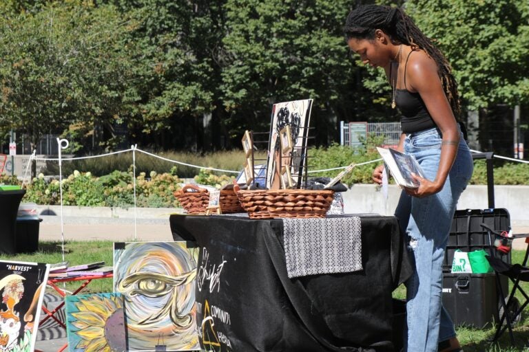 an artist at a booth