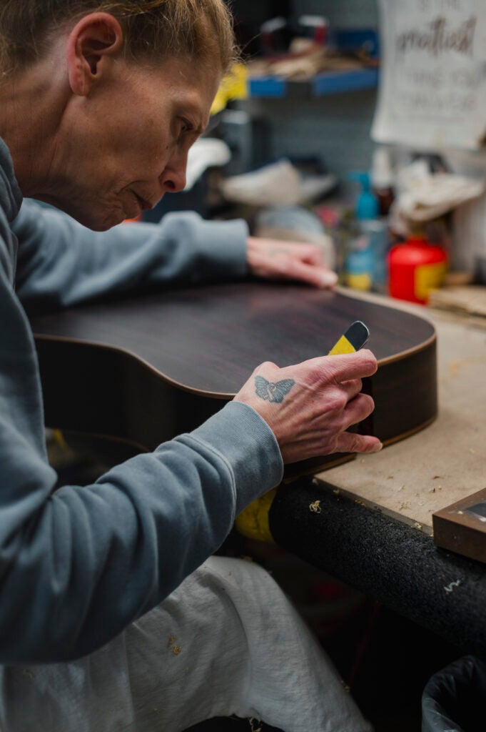 Tina Saginario cleans guitar binding