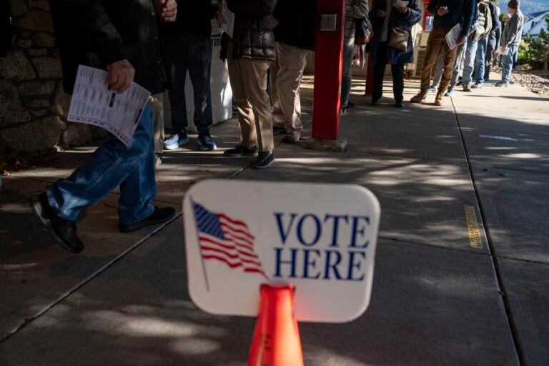 Voters wait to cast ballots