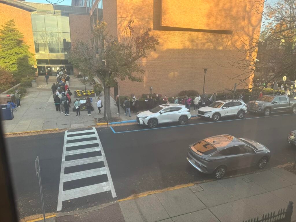 a window view of people in line