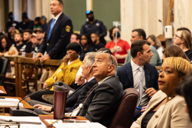 Mark Squilla watches arena protesters leave Philadelphia Council chambers