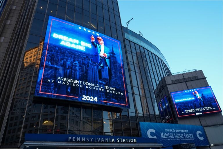 Video boards outside Madison Square Garden say PRESIDENT DONALD TRUMP AT MADISON SQUARE GARDEN 2024