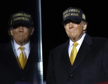 Republican presidential nominee, former President Donald Trump arrives for a campaign rally at in Traverse City, Mich., on Friday. Trump recorded the Joe Rogan Experience podcast earlier Friday and delayed his Michigan appearance by 3 hours. (Anna Moneymaker/Getty Images)