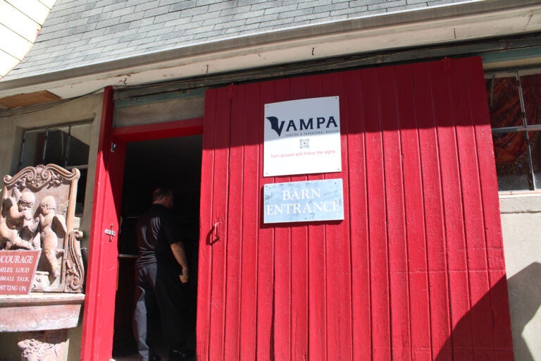 VAMPA sign hangs on a red building