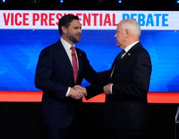 JD Vance and Tim Walz shake hands