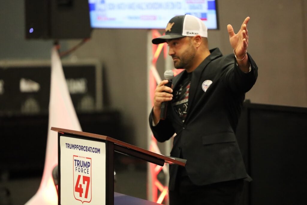 Eddie Alvarez speaking in front of a crowd