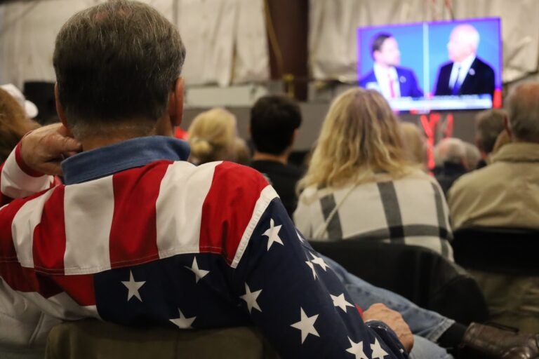 Voters watch the debate at the Republican watch party