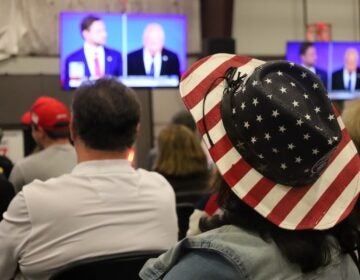 Voters watch the debate at the Republican watch party