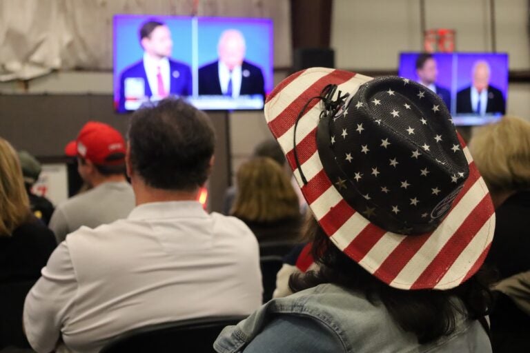 Voters watch the debate at the Republican watch party