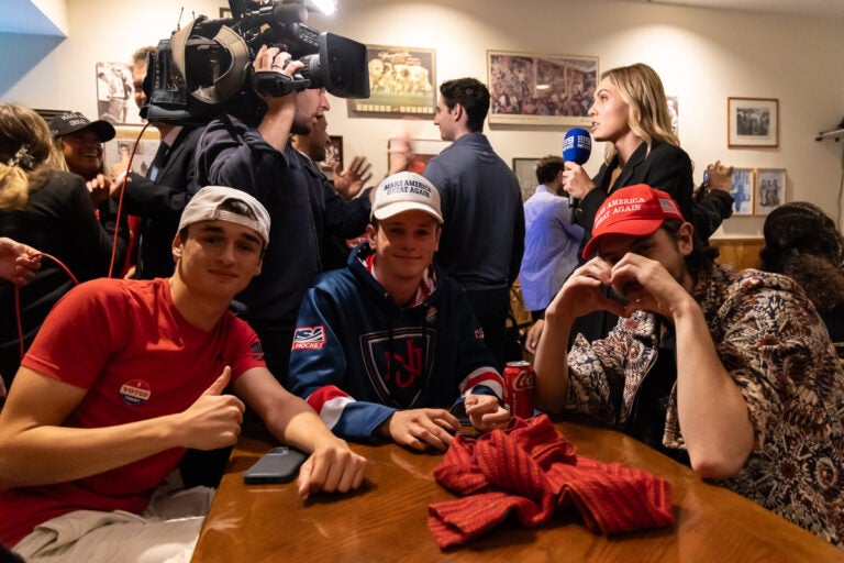 Trump supporters sit at a table