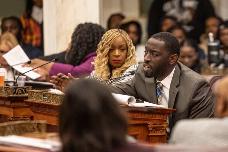 Isaiah Thomas speaking during a council hearing