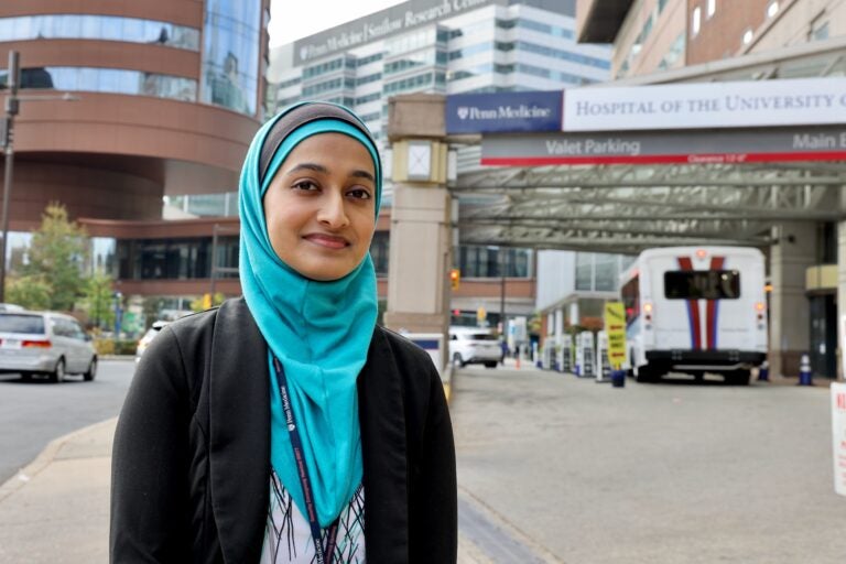 A doctor stands outside of the Hospital of the University of Pennsylvania