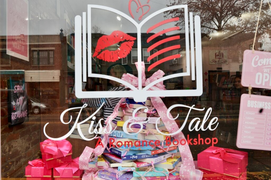 the window reads Kiss and Tale A Romance Bookshop