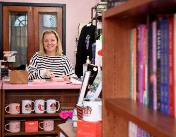 Katie Cunningham smiles behind a counter