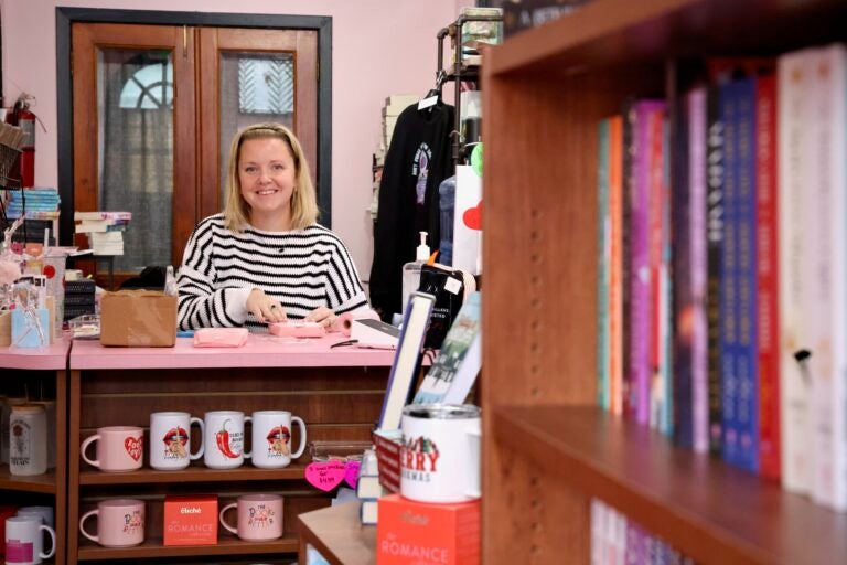 Katie Cunningham smiles behind a counter