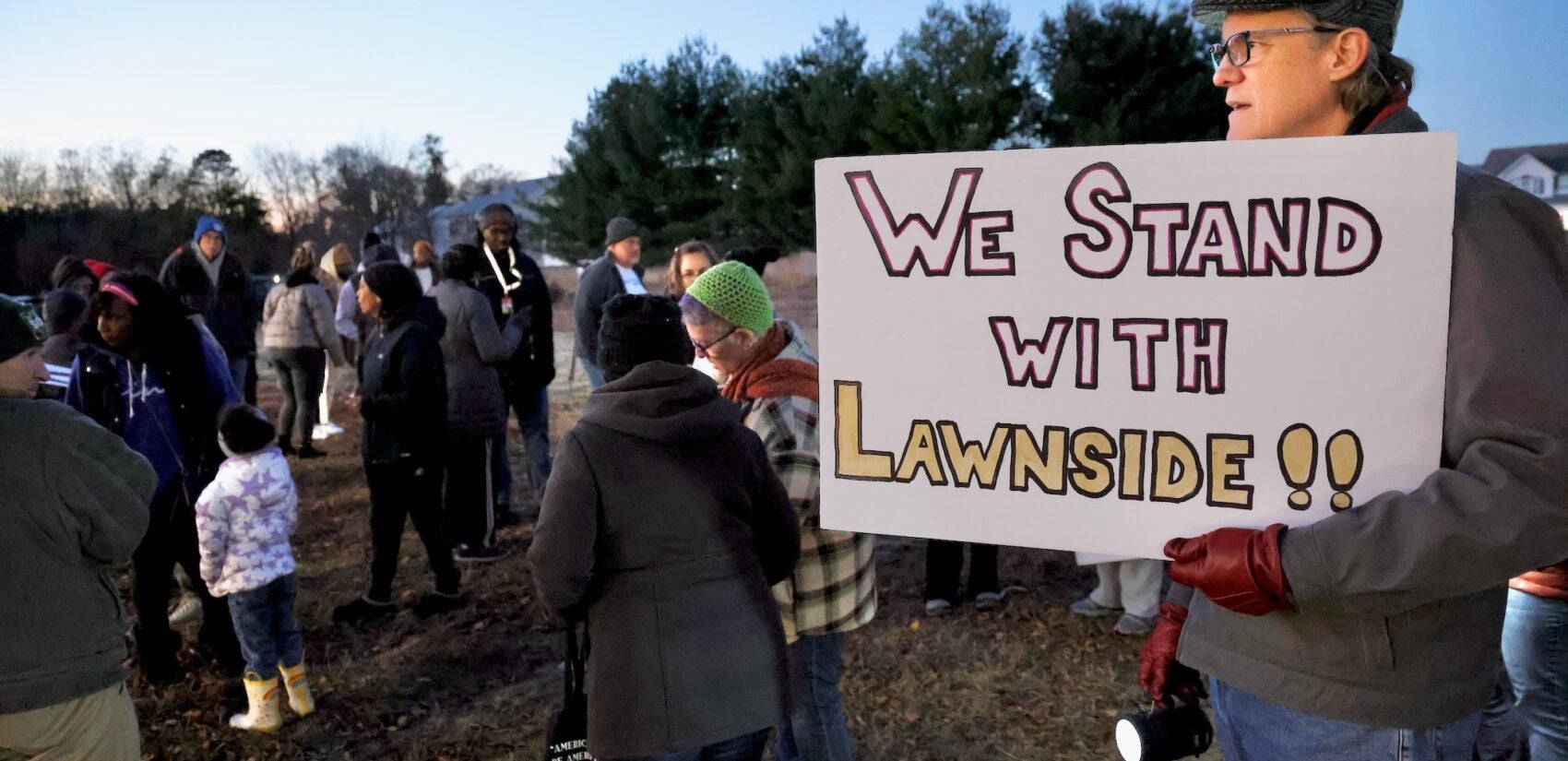 a sign reads We Stand WITH Lawnside!!