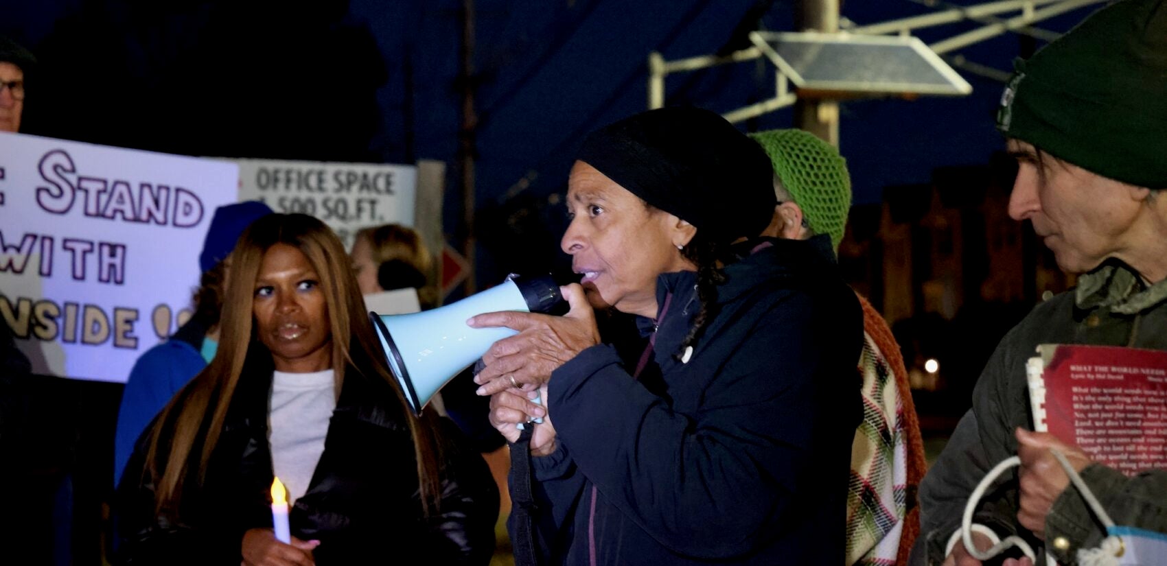 Myna Barbee speaks into a megaphone