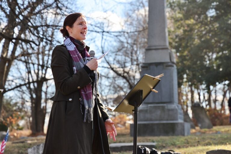 Forensic archaeologist Kimberlee Moran speaks at a memorial service for the hundreds of burials she helped to recover from a construction site at an 18th century burial ground on Arch Street in Old City, Philadelphia. (Emma Lee/WHYY)