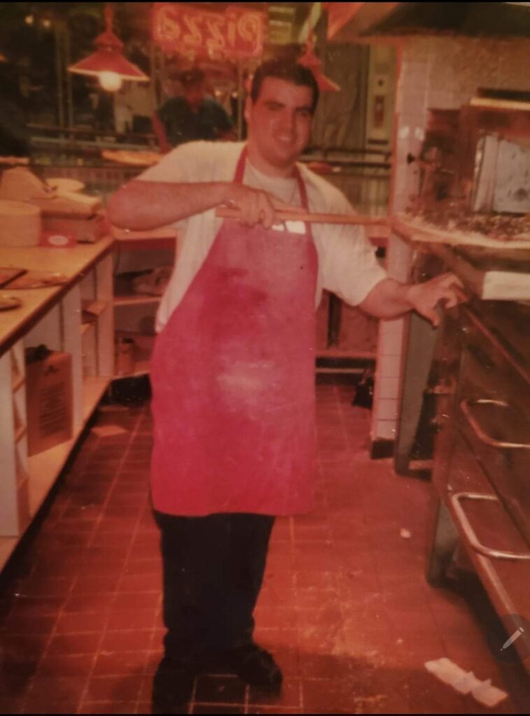 A young Alessandro Spennato cooks pizza in 1998