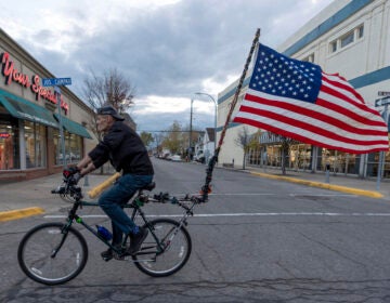 U.S. Army veteran, Doug Sherrill, 63, bikes to a polling site to vote for the first time in his life, Tuesday, Nov. 5, 2024, in Hamtramck, Mich. (AP Photo/David Goldman)