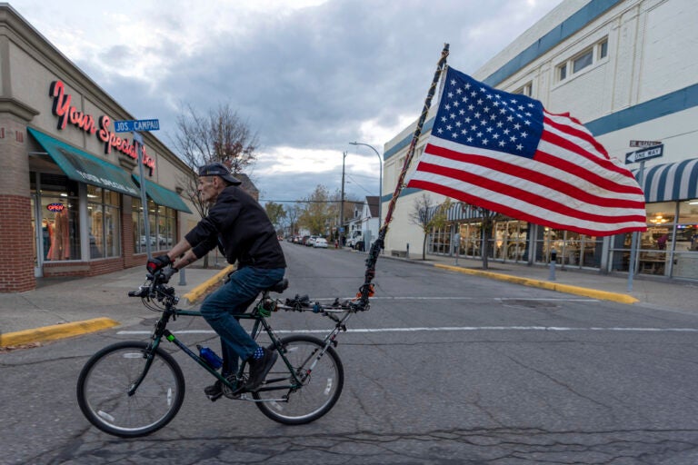 U.S. Army veteran, Doug Sherrill, 63, bikes to a polling site to vote for the first time in his life, Tuesday, Nov. 5, 2024, in Hamtramck, Mich. (AP Photo/David Goldman)