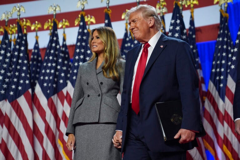 Republican presidential nominee former President Donald Trump stands with former first lady Melania Trump at an election night watch party at the Palm Beach Convention Center, Wednesday, Nov. 6, 2024, in West Palm Beach, Fla. (AP Photo/Evan Vucci)