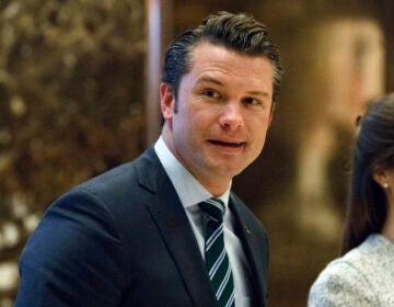 FILE - Pete Hegseth walks to an elevator for a meeting with President-elect Donald Trump at Trump Tower in New York, Dec. 15, 2016. (AP Photo/Evan Vucci, File)