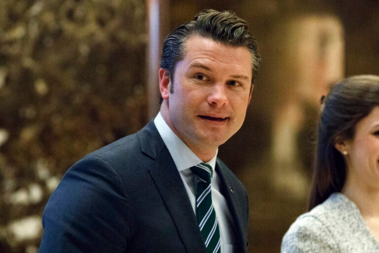 FILE - Pete Hegseth walks to an elevator for a meeting with President-elect Donald Trump at Trump Tower in New York, Dec. 15, 2016. (AP Photo/Evan Vucci, File)