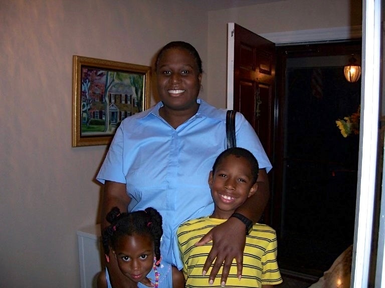 Hannah and Joshua Clarke, as kids, smile with their mother, Claudine