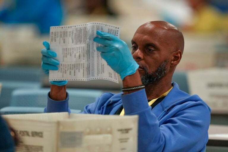 APTOPIX Election 2024 America Votes Pennsylvania An election worker processes mail ballots for the 2024 general election at the Philadelphia election warehouse, Tuesday, Nov. 5, 2024, in Philadelphia.