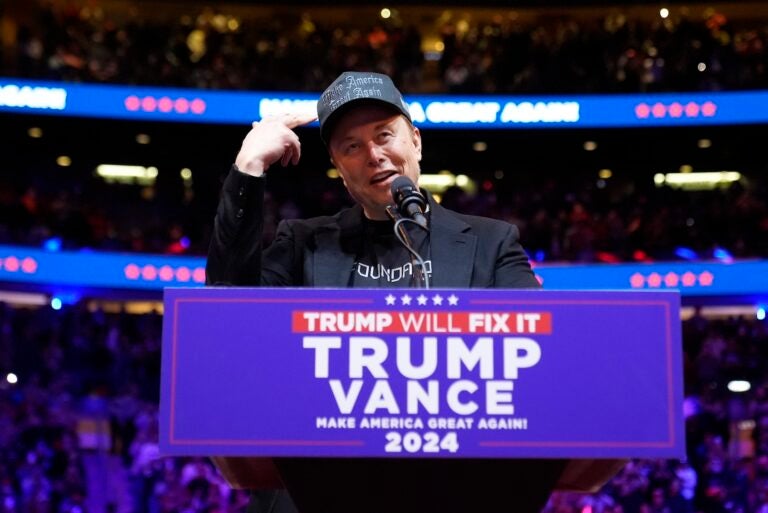 Elon Musk speaking at a Trump rally