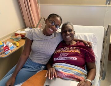 Hannah and Claudine Clarke smile in a hospital bed