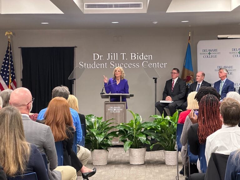 Jill Biden speaks behind a podium