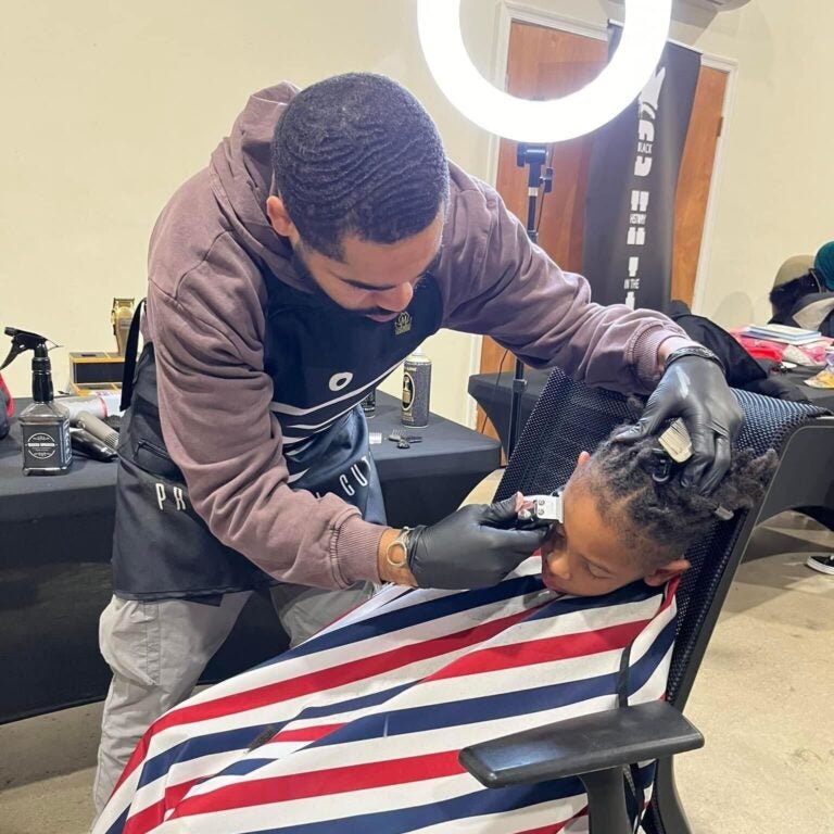 Adam Sair giving a haircut