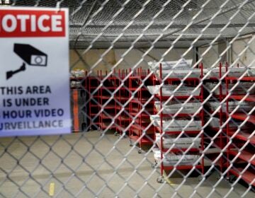 mail ballots behind a cage