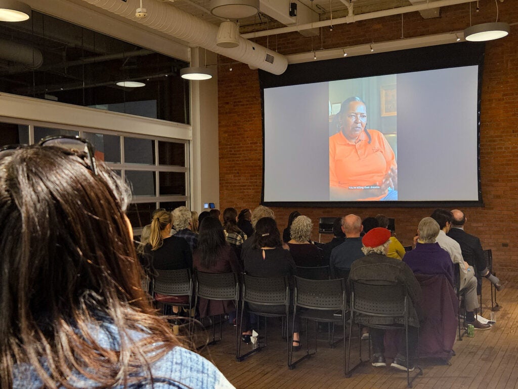 People watching a video presentation