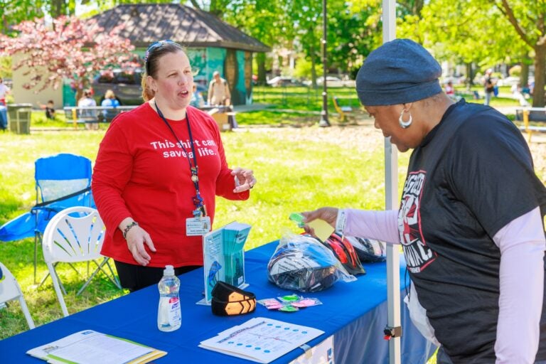 Sunny Jackson talks to someone at a booth