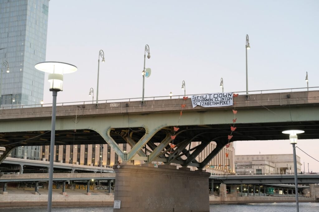 a banner hangs from the bidge