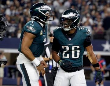 Philadelphia Eagles' Jalen Hurts, left, and Saquon Barkley