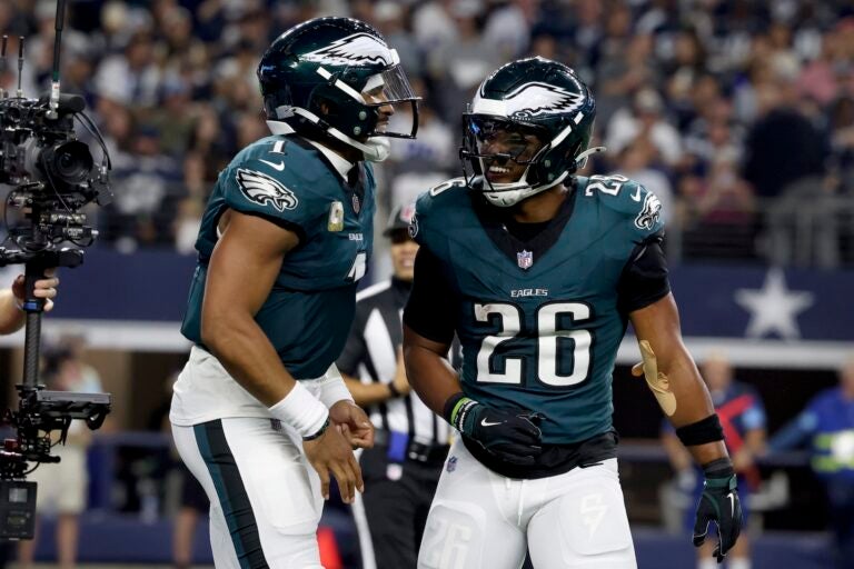 Philadelphia Eagles' Jalen Hurts, left, and Saquon Barkley