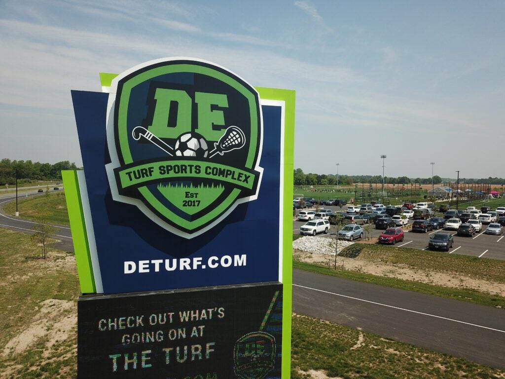 DE Turf Sports Complex sign at the entrance to the parking lot