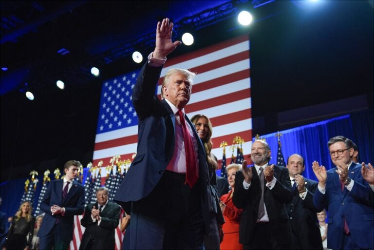 Donald Trump waves alongside Melania Trump