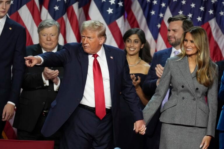 Republican Presidential nominee former President Donald Trump holds hands with former first lady Melania Trump after speaking to supporters at the Palm Beach County Convention Center during an election night watch party, Wednesday, Nov. 6, 2024, in West Palm Beach, Fla.