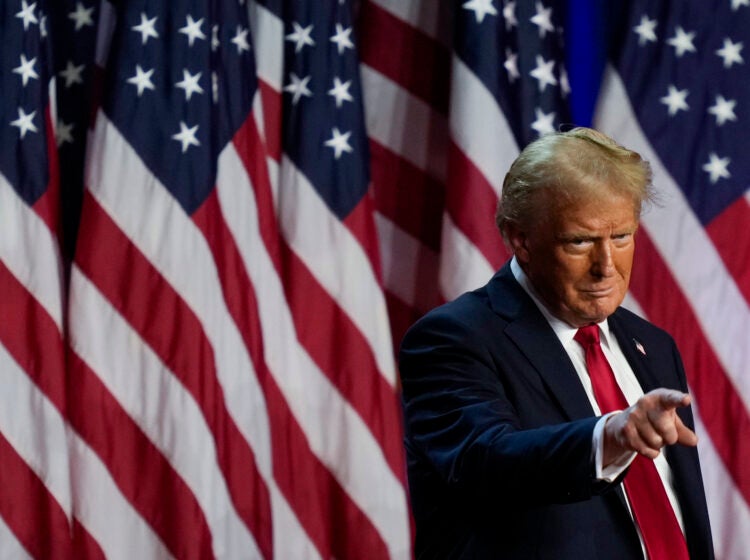 Republican presidential nominee former President Donald Trump points to the crowd at an election night watch party, Wednesday, Nov. 6, 2024, in West Palm Beach, Fla.