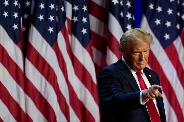 Republican presidential nominee former President Donald Trump points to the crowd at an election night watch party, Wednesday, Nov. 6, 2024, in West Palm Beach, Fla.