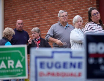 Voters stand in line while waiting for a polling place to open, Tuesday, Nov. 5, 2024, in Springfield, Pa.