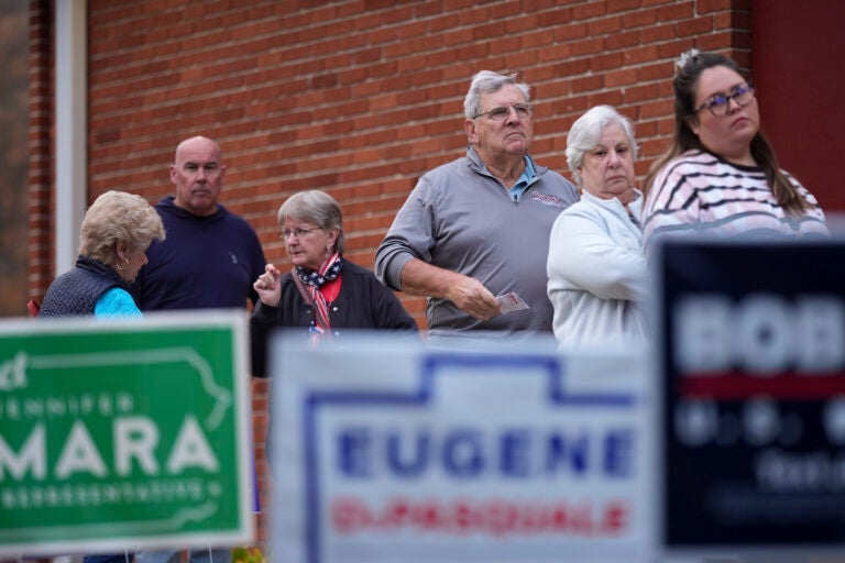 Voters stand in line while waiting for a polling place to open, Tuesday, Nov. 5, 2024, in Springfield, Pa.