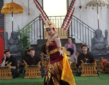 Sinta Penyami Storms performs the Tari Cendrawasih, the Birds of Paradise dance. (Emily Neil/WHYY)