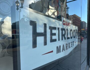 an indoor sign reads GIANT HEIRLOOM MARKET